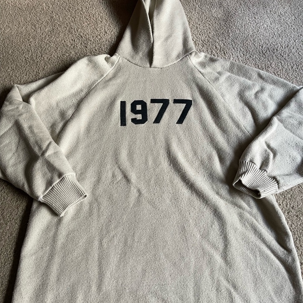 Fear of God Essentials Oatmeal Hoodie with Black 1977 Graphic